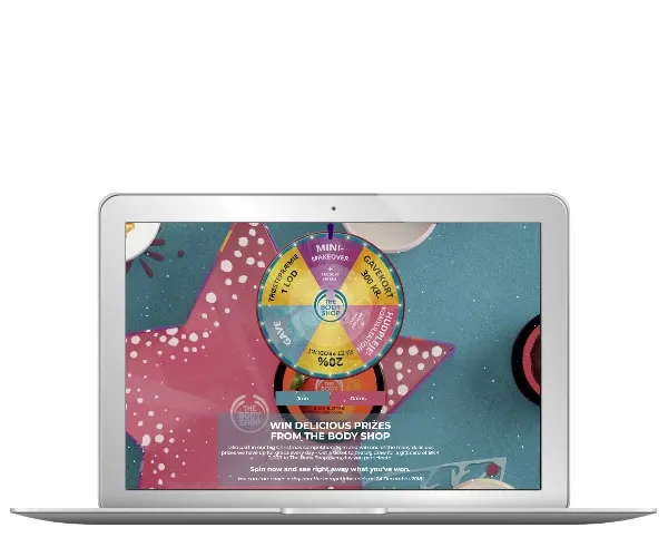 The Body Shop Spin the Wheel Advent campaign with beauty prizes on a laptop