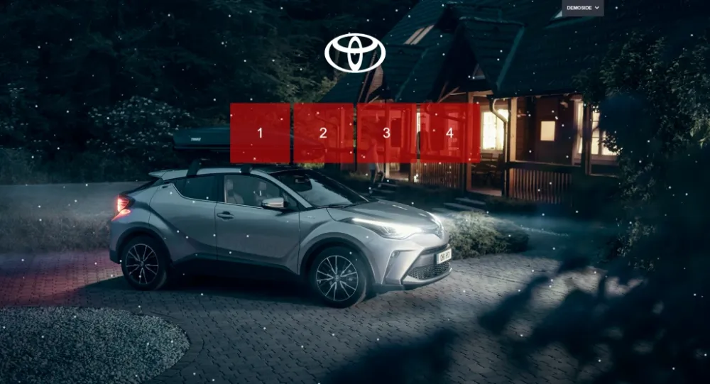 Toyota Advent calendar with four doors shown over a car in a snowy night scene